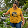 Woman wearing Greater Love John 15:13 Christian T-shirt in a community garden