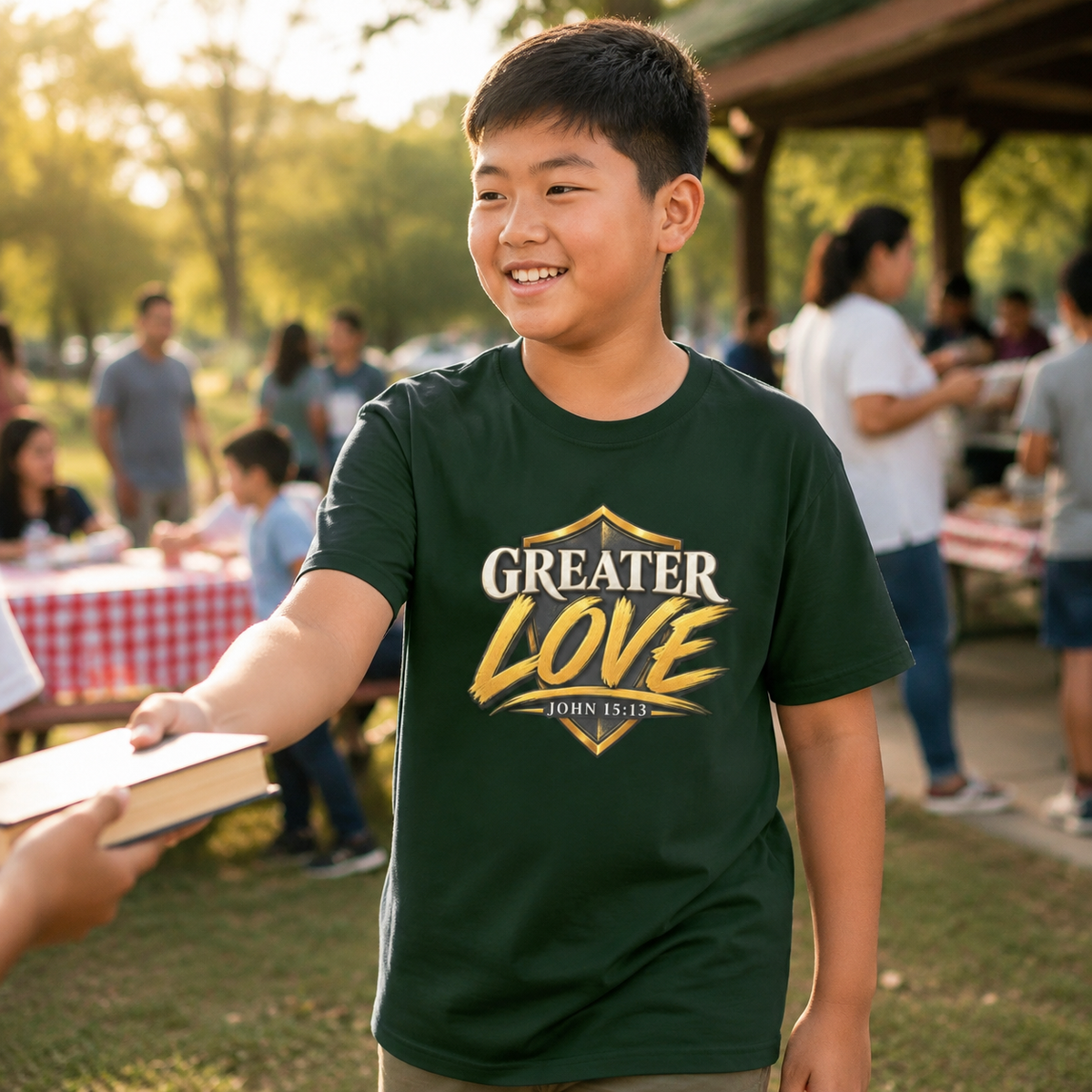 Youth wearing Greater Love John 15:13 Christian T-shirt at a church picnic