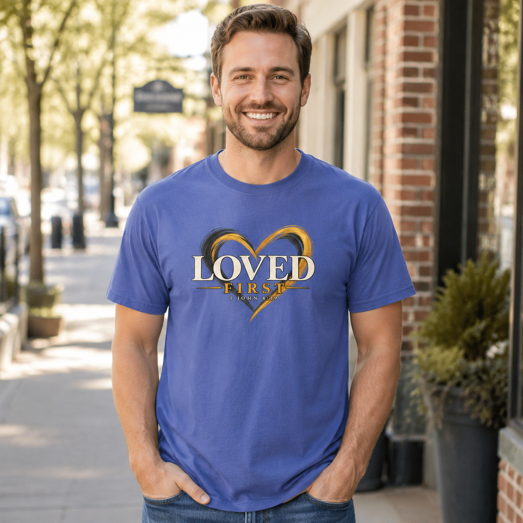 Man wearing the He First Loved Us 1 John 4:19 Christian T-shirt in Mystic Blue