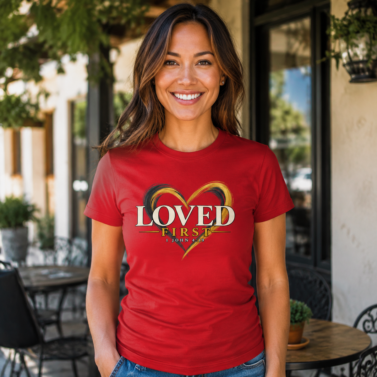 Woman wearing the He First Loved Us 1 John 4:19 Christian T-shirt in red