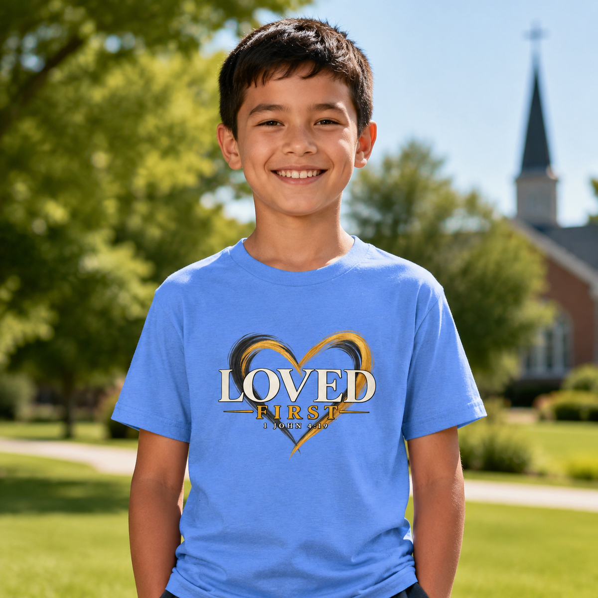 Youth wearing the He First Loved Us 1 John 4:19 Christian T-shirt in Heather Columbia Blue