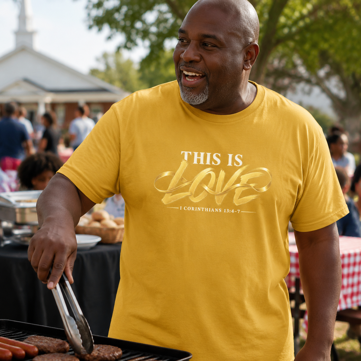 Man wearing This Is Love 1 Corinthians 13:4-7 Christian T-shirt at a community picnic
