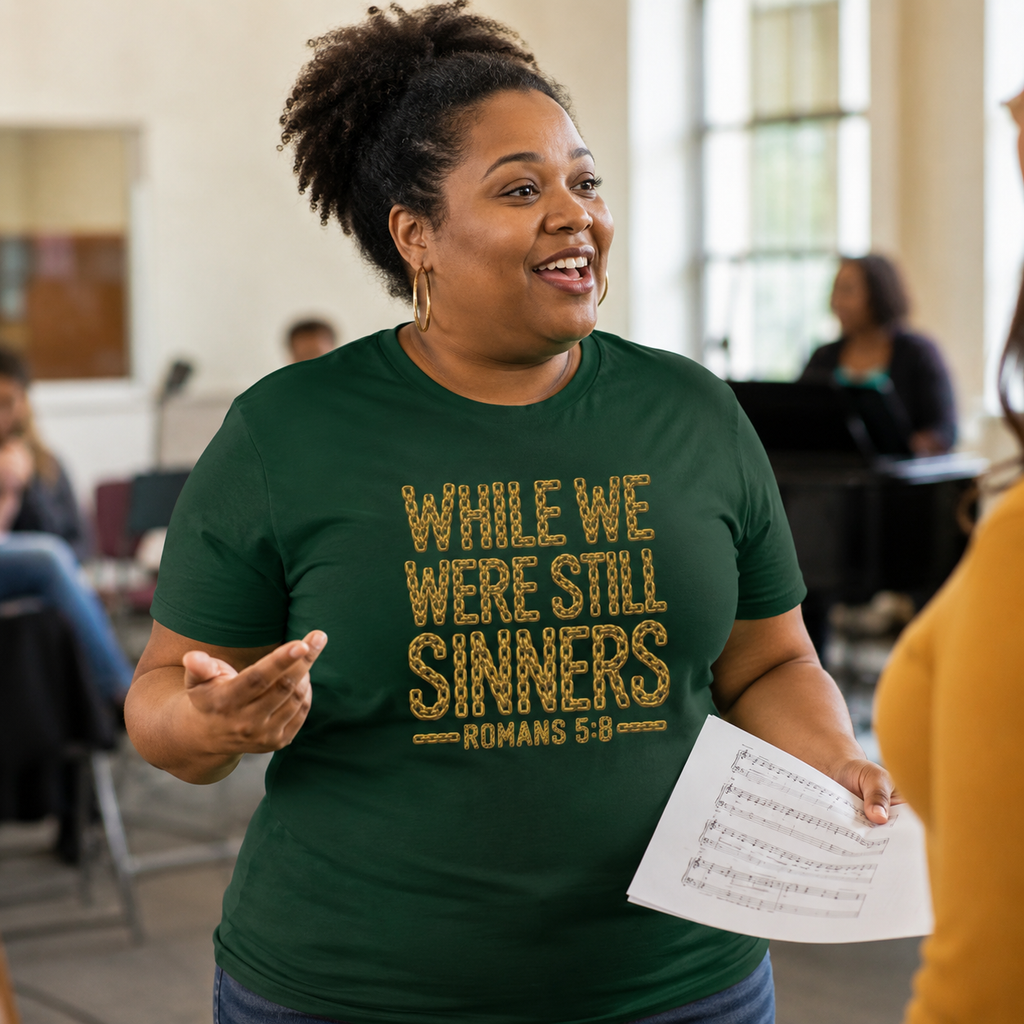 Woman wearing While We Were Still Sinners Romans 5:8 Christian T-shirt at choir rehearsal